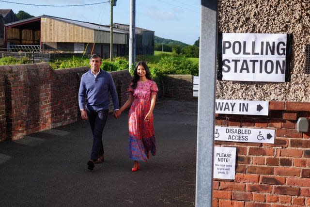 Prime Minister Rishi Sunak and his wife Akshata Murty arrive to cast their vote in the 2024 General Election at Kirby Sigston Village Hall in Northallerton 