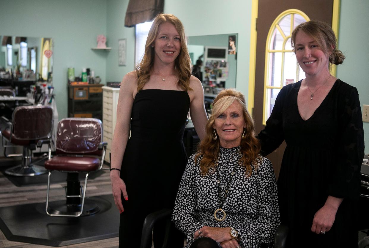 Lorrie Tipple (middle) sits in a salon chair with her daughters Melissa Tipple (left) and Jennifer Eshelman inside of The Ultimate Look III on May 8, 2024, in Lancaster, Ohio.