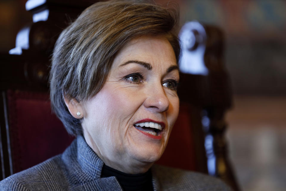 In this Nov. 7, 2019, photo Iowa Gov. Kim Reynolds speaks during an interview with The Associated Press in her formal office at the Statehouse in Des Moines, Iowa. For Reynolds, her drunken driving conviction nearly 20 years ago marked a turning point. Now, after becoming the state's first female governor, the Republican is using her experience as motivation for a stubborn campaign to restore the vote to felons that has divided her from many in her own party.(AP Photo/Charlie Neibergall)