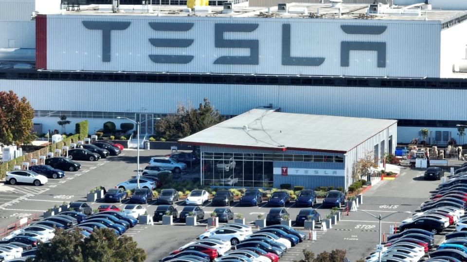In an aerial view from last October, new cars sit in a parking lot at the Tesla factory in Fremont, California. A judge has ordered the company to pay $3 million in punitive damages to Owen Diaz, who was a Black contractor at the location in 2015 and 2016. (Photo: Justin Sullivan/Getty Images)