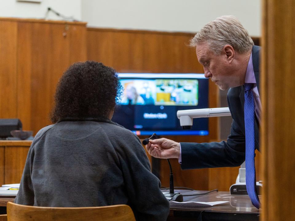 Attorney Patrick Anderson helps adjust the mic as Michelle Williams, sister of Dana Williams, delivers a victim impact statement during Bianca Coleman's sentencing in the December 2022 crash that killed Dana Williams on Wednesday, April 17, 2024, at the Milwaukee County Safety Building in Milwaukee.