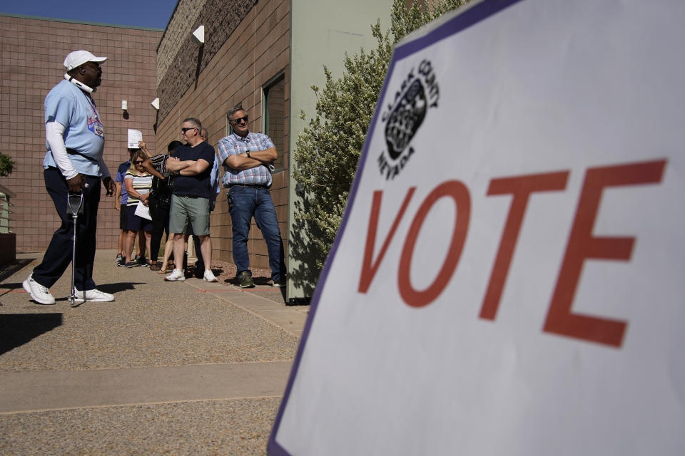 FILE - People wait in line to vote at a polling place on June 14, 2022, in Las Vegas. Seven Republicans vying for nomination for a Nevada Senate seat are participating Thursday, Jan. 18, 2024, in their first debate. (AP Photo/John Locher, File)