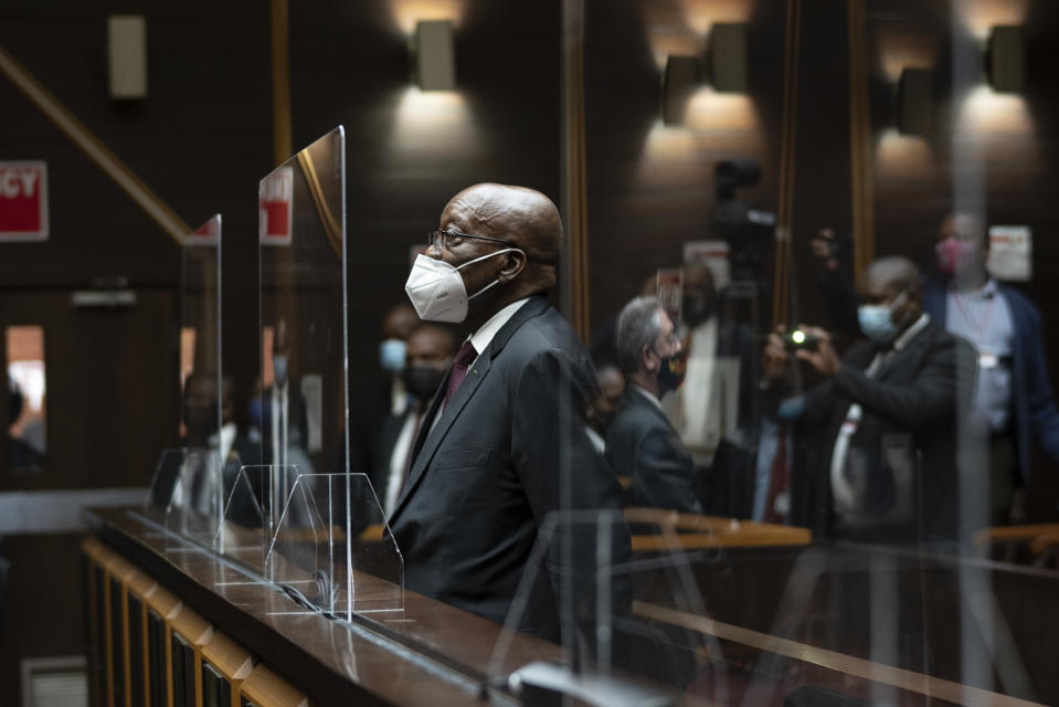 Former South African President Jacob Zuma, sits in the High Court in Pietermaritzburg, South Africa, Tuesday Oct. 26, 2021. Zuma has demanded to be acquitted of corruption charges because of the alleged abuse he has suffered at the hands of his prosecutors. He is in court facing charges of corruption, money laundering and racketeering. (AP Photo/Jerome Delay, Pool)