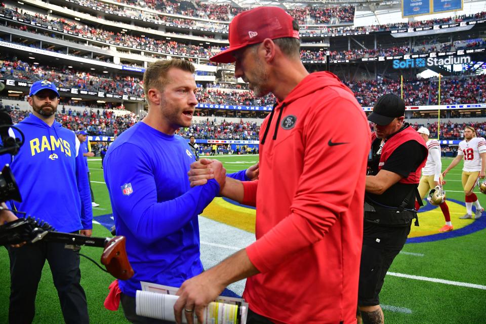 Los Angeles Rams head coach Sean McVay meets with San Francisco 49ers head coach Kyle Shanahan following a game at SoFi Stadium. Both young coaches have benefited from nepotism, but proved their coaching savvy through success. (Gary A. Vasquez-USA TODAY Sports)