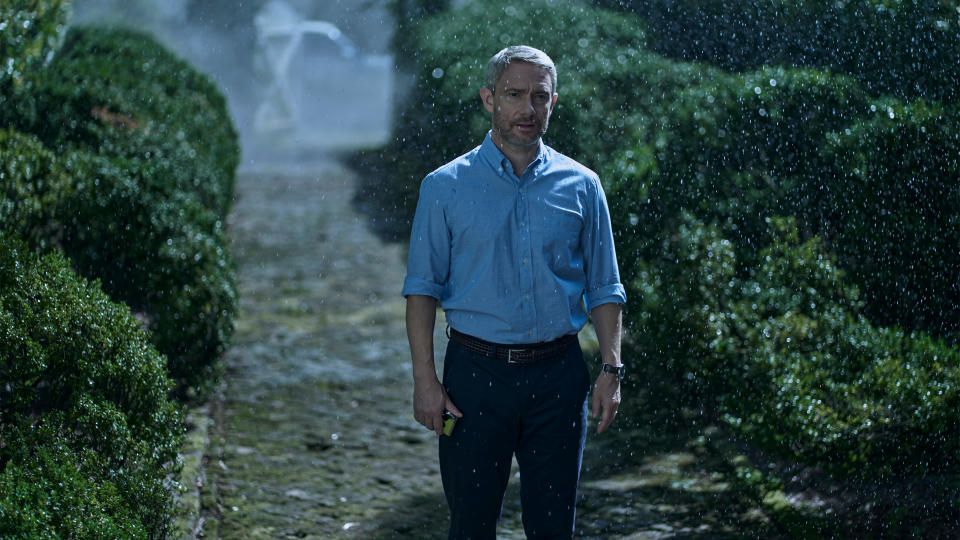 Martin Freeman stands in the rain in a scene from Miller’s Girl