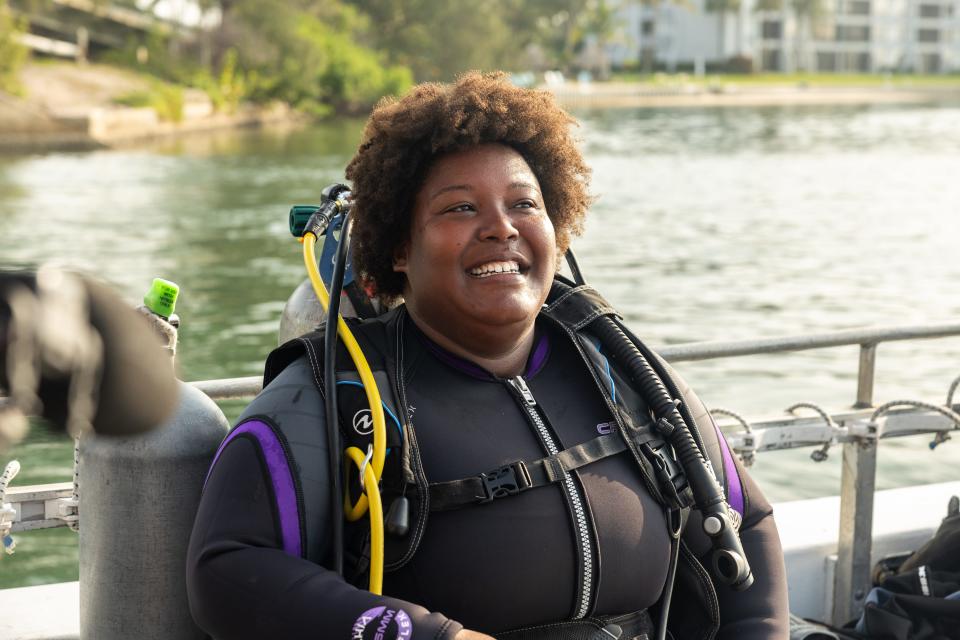 Dr. Tiara Moore, environmental ecologist and host of Discovery's "Sharks of the Dead Zone," preparing for a dive.