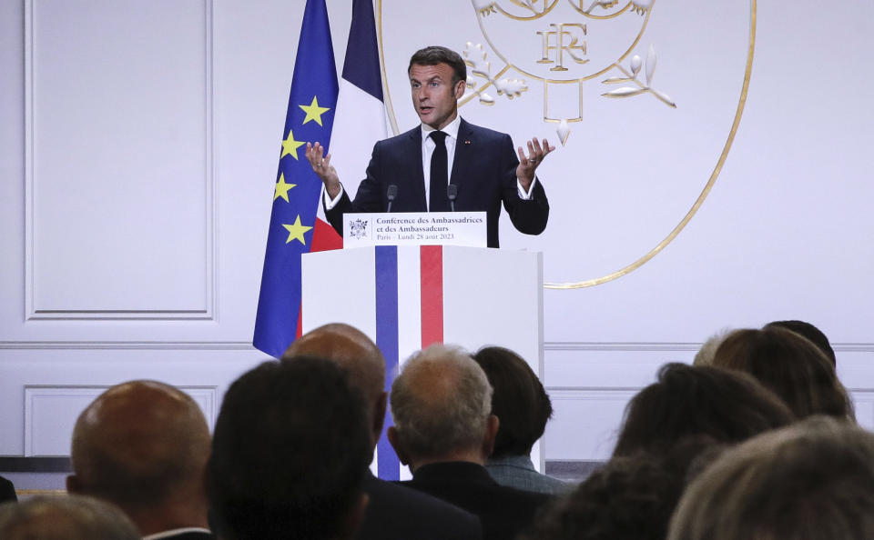 French President Emmanuel Macron gestures as he holds his annual foreign policy speech in front of French ambassadors at the Elysee Palace, in Paris, Monday Aug. 28, 2023. (Teresa Suarez, Pool via AP)