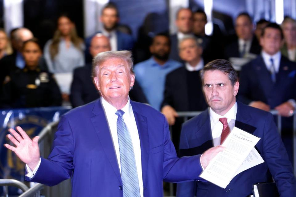 Donald Trump addresses reporters outside his hush money trial next to defense attorney Todd Blanche on May 20. (Getty Images)