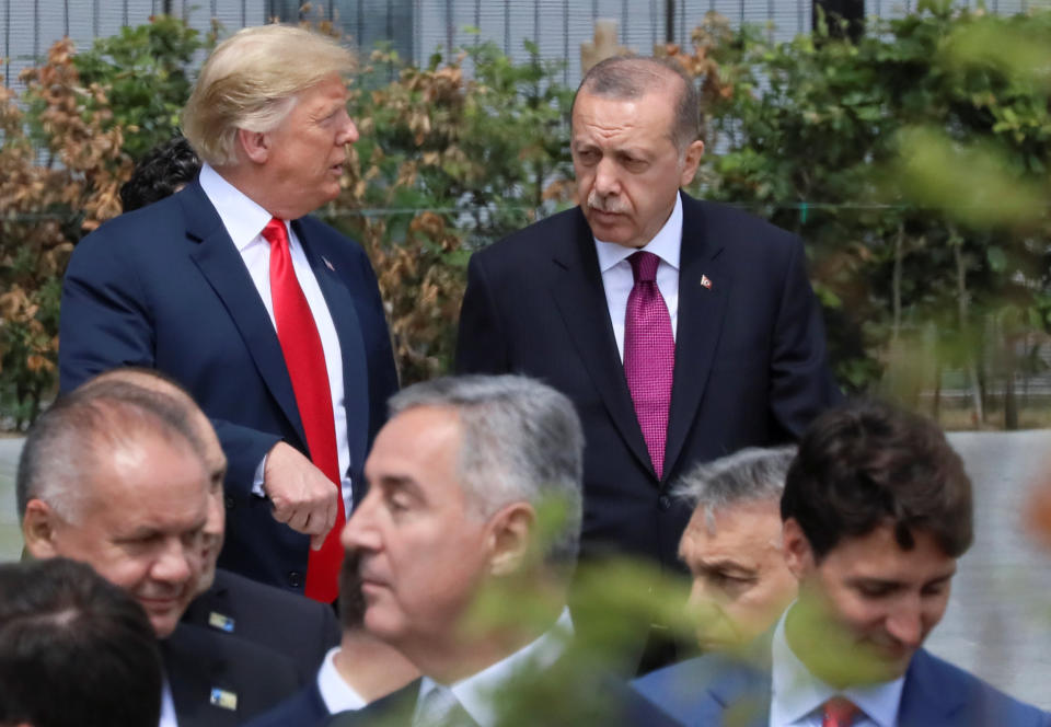 U.S. President Donald Trump, Turkish President Tayyip Erdogan and Canada's Prime Minister Justin Trudeau are seen at the start of the NATO summit in Brussels, Belgium July 11, 2018. REUTERS/Reinhard Krause