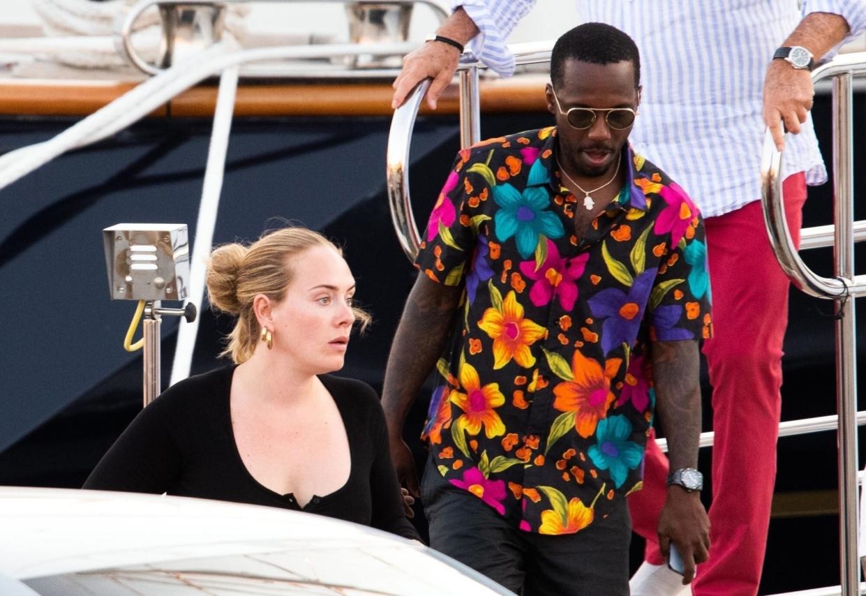 Sardinia, ITALY - Singer Adele looks in a good mood while seen with her boyfriend Rich Paul pictured enjoying their romantic holiday in Sardinia. The happy couple looked in good spirits while seen relaxing on a luxury yacht during their summer holiday in Sardinia, Adele looked casually fashionable in a black outfit with a matching Balenciaga handbag. Pictured: Adele, Rich Paul BACKGRID USA 23 JULY 2022 USA: +1 310 798 9111 / usasales@backgrid.com UK: +44 208 344 2007 / uksales@backgrid.com *UK Clients - Pictures Containing Children Please Pixelate Face Prior To Publication*