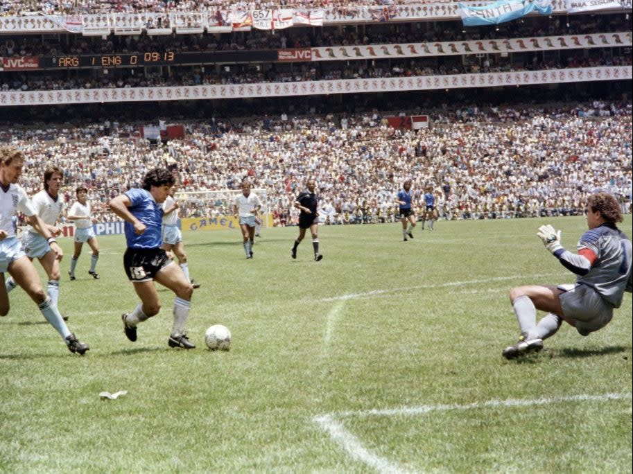 <p>Diego Maradona dribbles past Terry Butcher</p>AFP