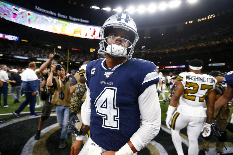 Dallas Cowboys quarterback Dak Prescott (4) walks off the field after an NFL football game against the New Orleans Saints in New Orleans, Sunday, Sept. 29, 2019. The Saints won 12-10. (AP Photo/Butch Dill)