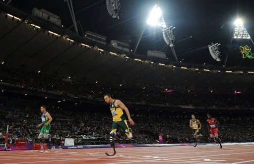 Brazil's Alan Fonteles Cardoso Oliveira (L) beats South Africa's Oscar Pistorius (2nd L) in the Men's 200m T44 Final athletics event during the London 2012 Paralympic Games