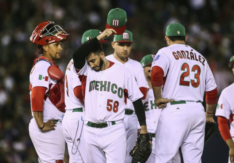 Mexico pitcher Miguel Gonzalez walks off the field after being relieved during the team's World Baseball Classic game against Puerto Rico in Guadalajara, Mexico, Saturday, March 11, 2017. (AP Photo/Luis Gutierrez)