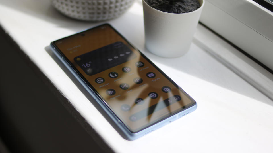 Google Pixel 7a phone screen on a white windowsill