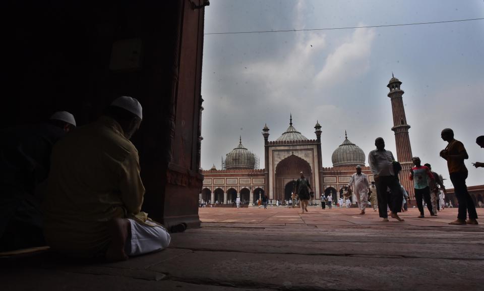 NEW DELHI, INDIA - JULY 31: Devotees offer prayers at Jama Masjid on the eve of Eid-al Adha festival, on July 31, 2020 in New Delhi, India. The holy festival of sacrifice, which falls on the 10th day of Dhu al-Hijjah as per the Islamic lunar calendar, is being celebrated today. Bakra Eid or Bakrid is marked by sacrificing an animal that is close to them to prove their devotion and love for Allah. Post the sacrifice, devotees distribute the offering to family, friends, neighbours and especially to the poor and the needy. (Photo by Raj K Raj/Hindustan Times via Getty Images)