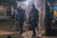 In this photo provided by Azov Special Forces Regiment of the Ukrainian National Guard Press Office, Ukrainian soldiers injured during fighting against Russian forces, poses for a photographer inside the Azovstal steel plant in Mariupol, Ukraine, May 10, 2022. For nearly three months, Azovstal’s garrison clung on, refusing to be winkled out from the tunnels and bunkers under the ruins of the labyrinthine mill. A Ukrainian soldier-photographer documented the events and sent them to the world. Now he is a prisoner of the Russians. His photos are his legacy.(Dmytro Kozatsky/Azov Special Forces Regiment of the Ukrainian National Guard Press Office via AP)