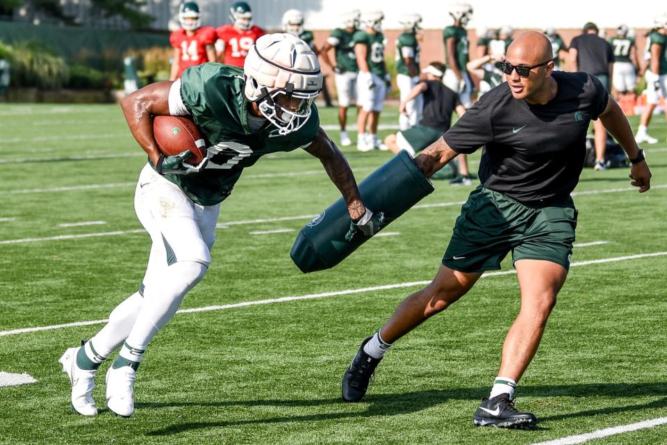 Michigan State's Keon Coleman runs after a catch during football camp on Tuesday, Aug. 17, 2021, on the MSU campus in East Lansing.