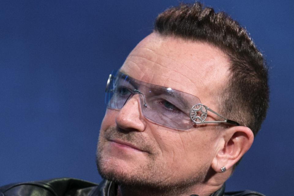 The lead singer of Irish rock group U2, Bono, listens during the Clinton Global Initiative 2013 (CGI) in New York September 24, 2013. REUTERS/Lucas Jackson (UNITED STATES - Tags: POLITICS ENTERTAINMENT HEADSHOT)