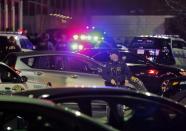 Police secure the area after reports that a gunman fired shots at the Garden State Plaza mall in Paramus, New Jersey, November 4, 2013. A person with a gun opened fire on Monday evening in the massive New Jersey shopping mall shortly before closing time, leading police to evacuate the mall and search for the shooter, but no injuries were reported, officials said. (REUTERS/Ray Stubblebine)