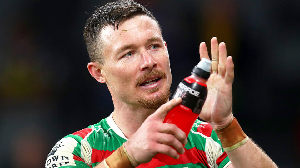 This photo shows Damien thanking South Sydney Rabbitohs fans after an NRL game.