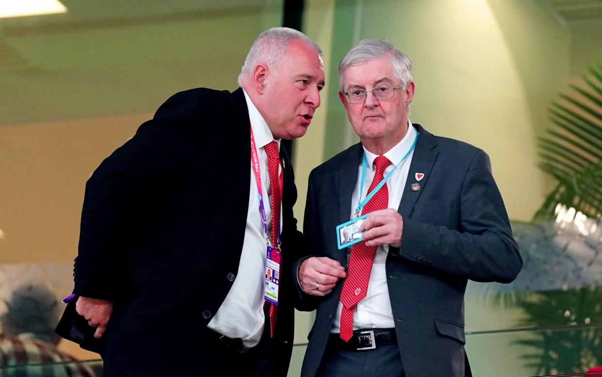 Wales First Minister Mark Drakeford (right) in the stands ahead of the FIFA World Cup Group B match at the Ahmad Bin Ali Stadium, Al-Rayyan. Picture date: Monday November 21, 2022. - Mike Egerton/PA 