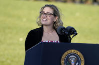FILE - Sen. Kyrsten Sinema, D-Ariz., speaks before President Joe Biden signs the $1.2 trillion bipartisan infrastructure bill into law during a ceremony on the South Lawn of the White House in Washington, Nov. 15, 2021. Sinema received a $1 million surge of campaign cash over the past year from private equity professionals, hedge funds and venture capitalists whose interests she has staunchly defended in Congress. That's according to an Associated Press review of campaign finance disclosures.(AP Photo/Evan Vucci, File)