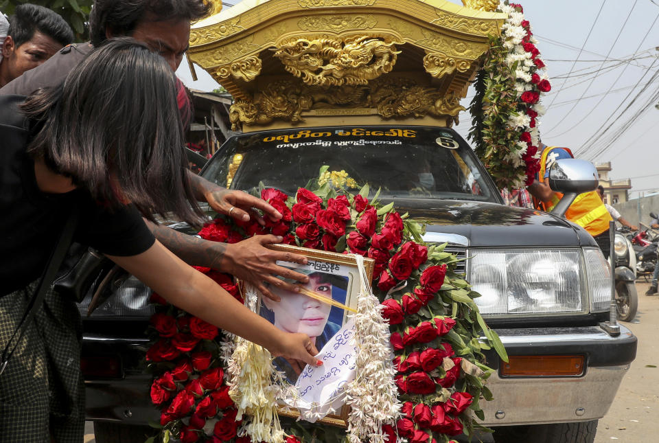 A hearse carrying the body of Saw Pyae Naing is driven in Mandalay, Myanmar, Sunday, March 14, 2021. Saw Pyae Naing, a 21-year old anti-coup protester was shot and killed by Myanmar security forces during a demonstration on Saturday, according to his family. (AP Photo)