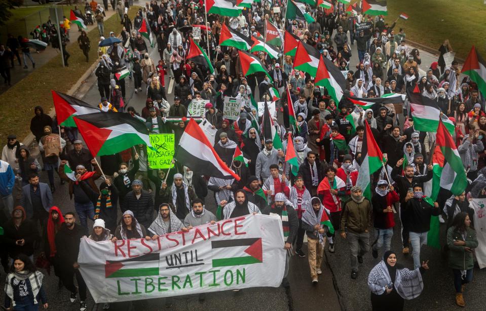 Hundreds of people march through the streets during the All Out for Palestine rally, organized by the Palestinian Youth Movement (PYM) and local chapters of Students for Justice in Palestine (SJP) in Dearborn on Saturday, Oct. 14, 2023.