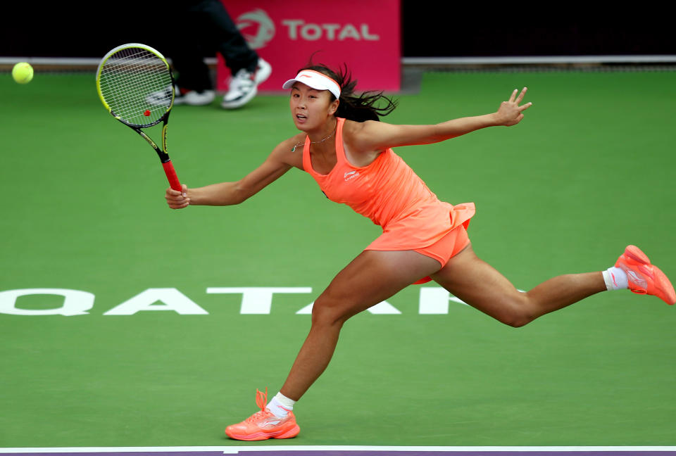 China's Peng Shuai returns the ball during a match against Russia's Nadia Petrova on the first day of the WTA Qatar Ladies Open in Doha, Qatar, Monday, Feb. 10, 2014. (AP Photo/Osama Faisal)