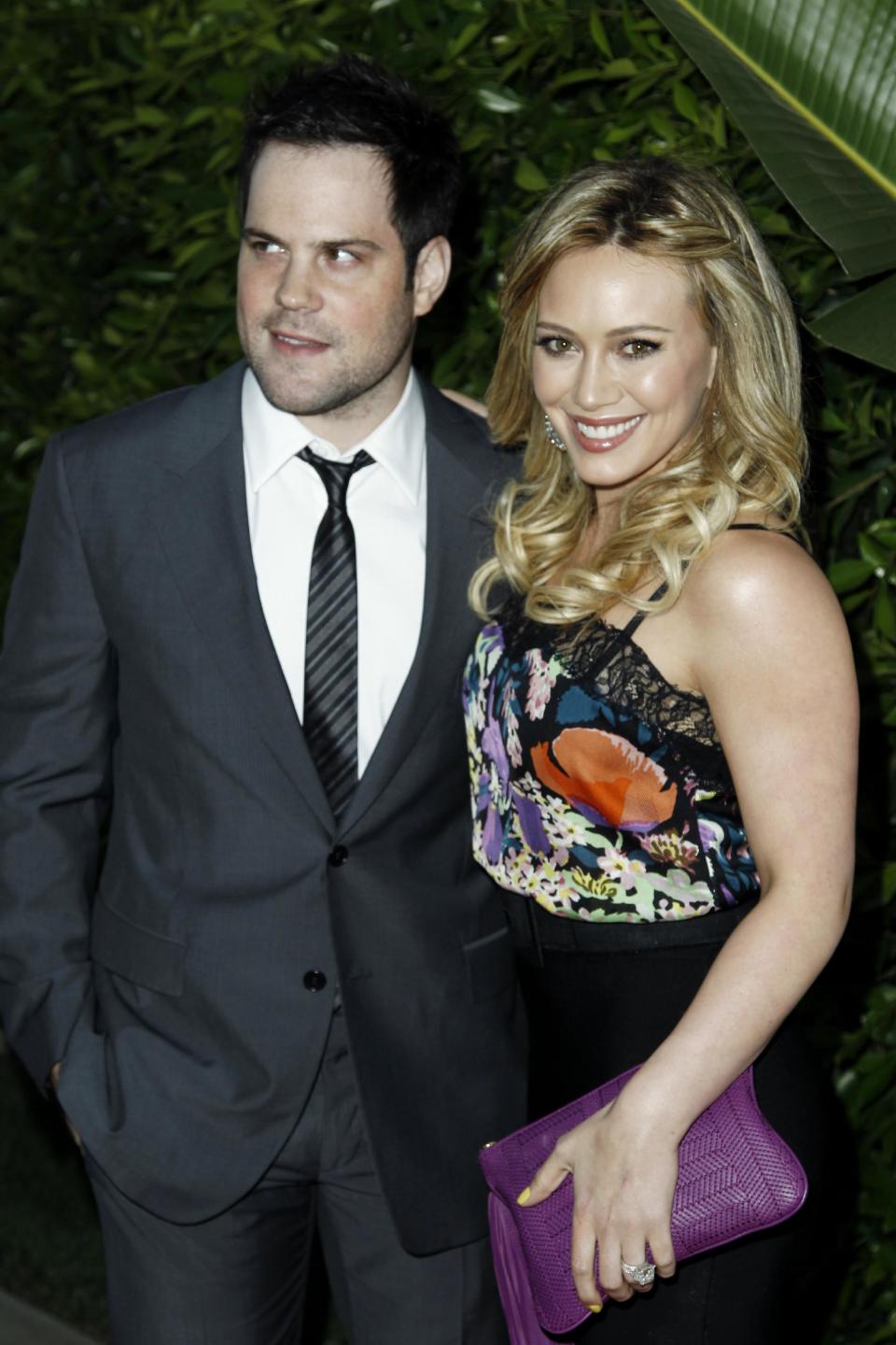 FILE - In this May 11, 2011 file photo, Hilary Duff, right, and Mike Comrie arrive at an Evening of "Southern Style" presented by The St. Bernard Project and the Spears Family in Beverly Hills, Calif. Duff and her husband Comrie are calling it quits after three years or marriage according to Duff's reps. on Friday, Jan. 10, 2014. (AP Photo/Matt Sayles, File)