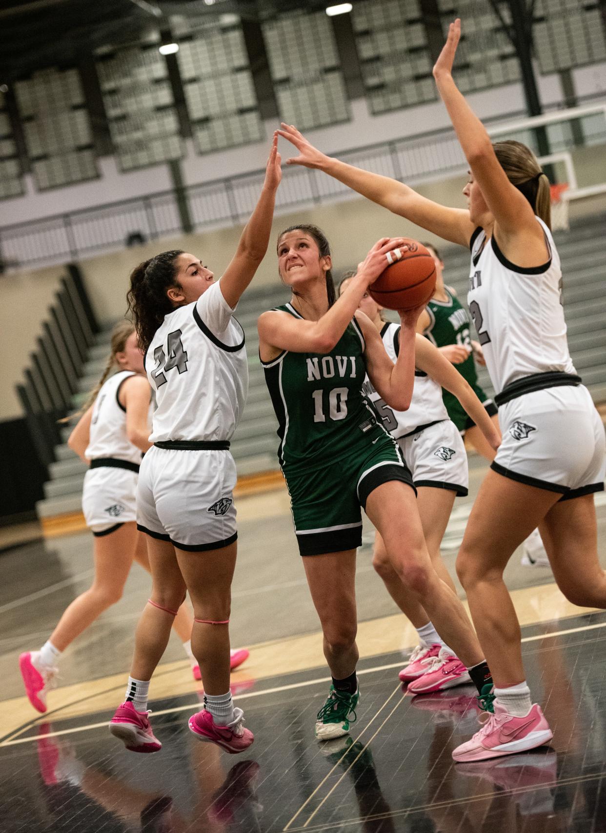 Novi's Jordan Popyk battles down low during a Kensington Lakes Activities Association-West girls basketball game on Wednesday, Jan. 31, 2024.