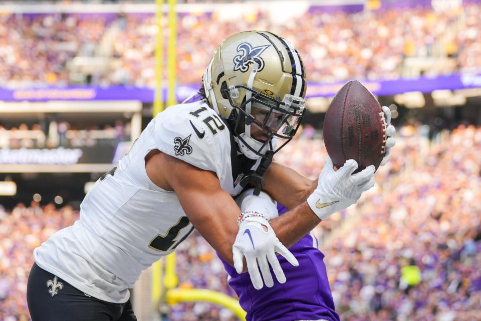 New Orleans Saints wide receiver Chris Olave catches a pass for a touchdown against the Minnesota Vikings in the third quarter at U.S. Bank Stadium.