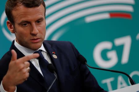 French President Emmanuel Macron speaks at a press conference at the end of the G7 Summit in Taormina, Sicily, Italy, May 27, 2017. REUTERS/Philippe Wojazer