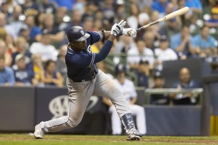 Aug 7, 2018; Milwaukee, WI, USA; San Diego Padres right fielder Franmil Reyes (32) hits an two run double during the seventh inning against the Milwaukee Brewers at Miller Park. Mandatory Credit: Jeff Hanisch-USA TODAY Sports