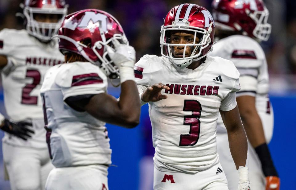 Muskegon's M’Khi Guy (3) looks at a teammate during an offensive snap against Warren De La Salle during the Division 2 football state championship game at Ford Field in Detroit on Saturday, Nov. 25, 2023.