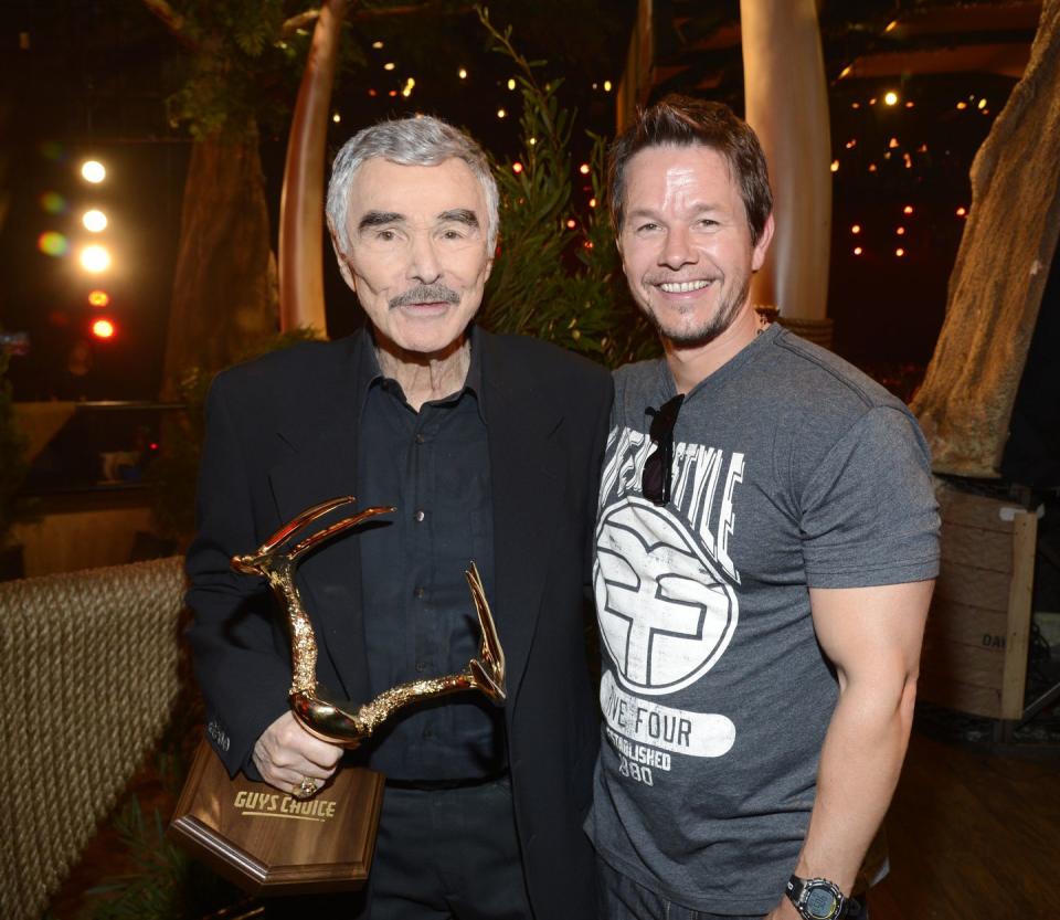 <p>Reynolds poses with Mark Wahlberg backstage at the 2013 Spike TV Guys Choice Awards, in which Reynolds won the Alpha Male award. </p>