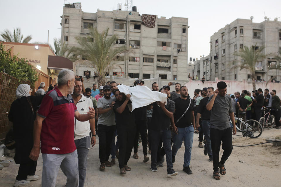 Palestinians carry a person killed by Israeli bombardment to their burial in Khan Younis, southern Gaza Strip, Friday, June 21, 2024. (AP Photo /Jehad Alshrafi)