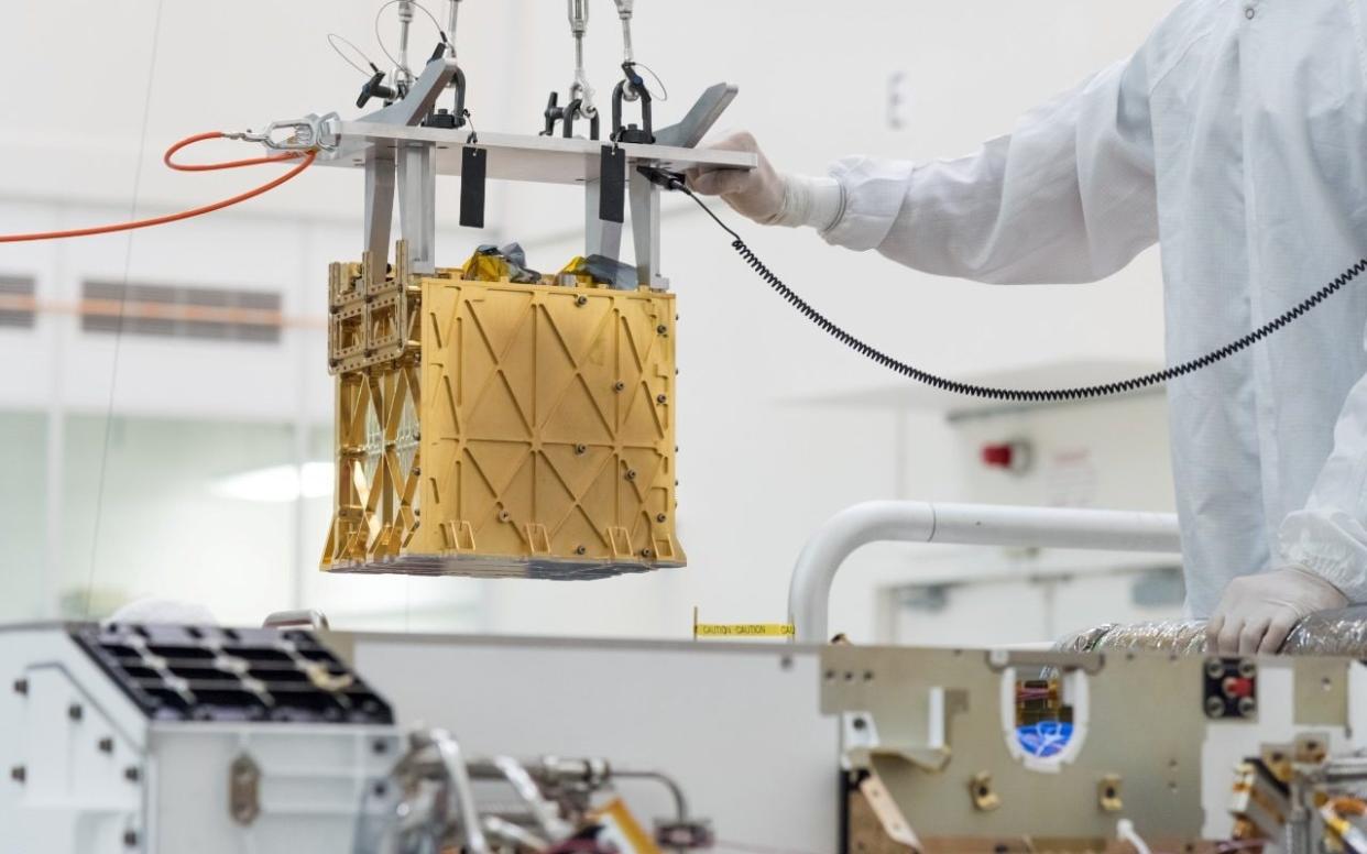 The Mars Oxygen In-Situ Resource Utilisation Experiment - or MOXIE - is a golden box the size of a toaster - NASA/JPL-Caltech/Handout via REUTERS