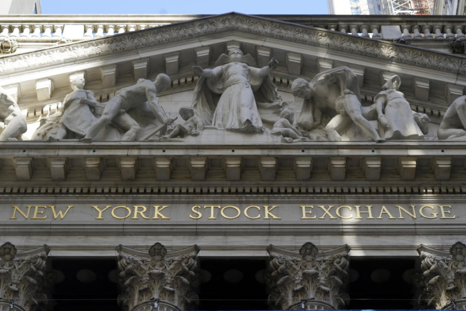 FILE - The facade of the New York Stock Exchange, is seen Wednesday, June 16, 2021. Stocks are wobbling between small gains and losses in the early going on Wall Street, keeping major indexes close to the record highs they set last week. The S&P 500 and the Dow Jones Industrial Average were little changed in the early going Monday, July 26. (AP Photo/Richard Drew, File)