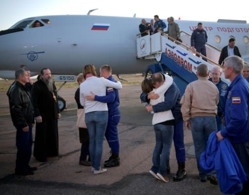 NASA astronaut Nick Hague and Russian cosmonaut Alexey Ovchinin were greeted by family members and officials after landing in Kazakhstan