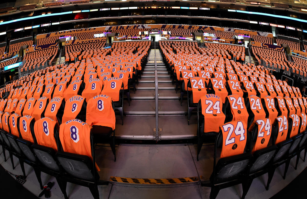 California bride and groom wear LA Lakers jerseys, take e-session photos at  Staples Center