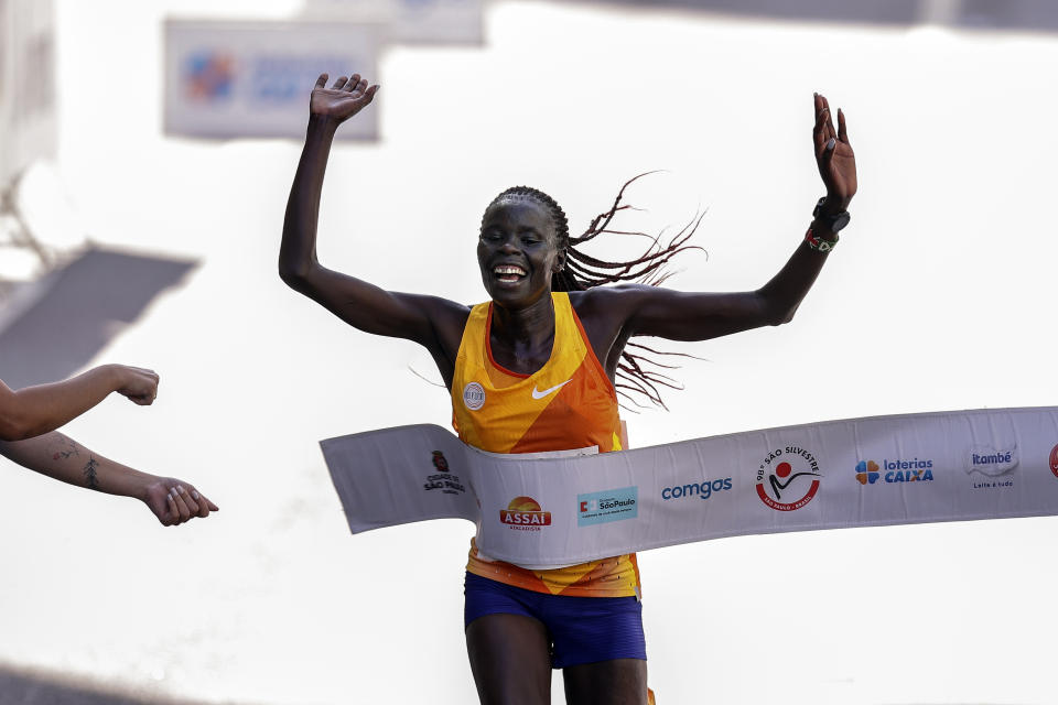 Kenya's Catherine Reline crosses the finish line to win the Sao Silvestre women's road race in Sao Paulo, Brazil, Dec. 31, 2023. The 15-kilometer race is held annually on New Year's Eve. (AP Photo/Ettore Chiereguini)