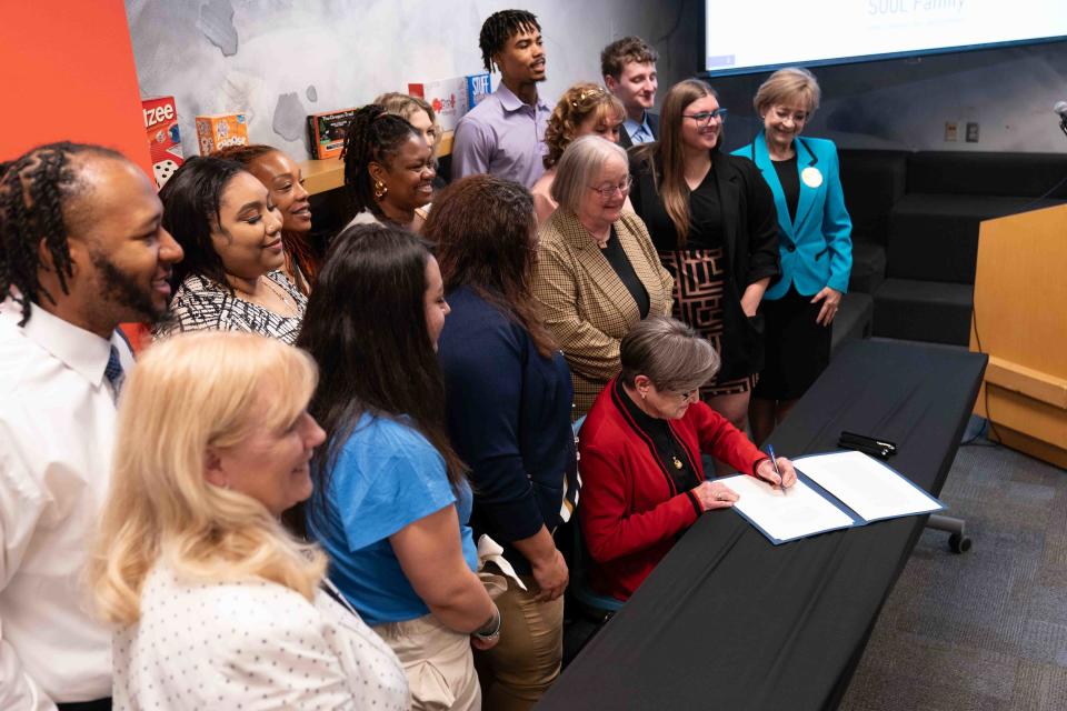 Gov. Laura Kelly signs HB2536 into law Tuesday morning during a ceremonial bill signing event at the Topeka & Shawnee County Public Library. The bill creates an option of SOUL family permanence for foster care youths.