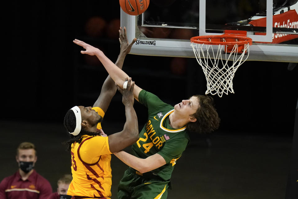 Iowa State forward Solomon Young shoots over Baylor guard Matthew Mayer (24) during the second half of an NCAA college basketball game, Saturday, Jan. 2, 2021, in Ames, Iowa. Baylor won 76-65. (AP Photo/Charlie Neibergall)