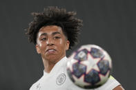Manchester City's Rico Lewis eyes the ball during a training session at the Ataturk Olympic Stadium in Istanbul, Turkey, Friday, June 9, 2023. Manchester City and Inter Milan are making their final preparations ahead of their clash in the Champions League final on Saturday night. (AP Photo/Antonio Calanni)