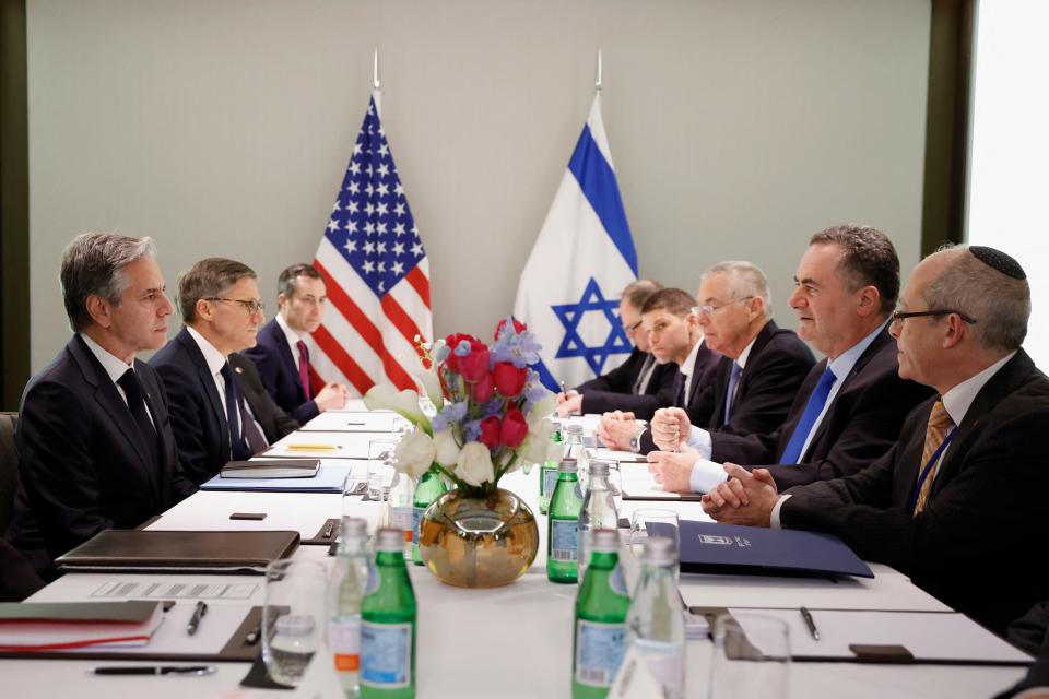 US Secretary of State Antony Blinken (L) meets with Israel's Foreign Minister Israel Katz (2nd-R) in Tel Aviv on January 9, 2024.