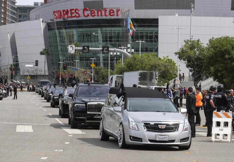 The hearse carrying rapper Nipsey Hussle leaves Staples Center after a memorial service in Los Angeles, Thursday, April 11, 2019. Hussle was killed in a shooting outside his Marathon Clothing store in south Los Angeles on March 31. (AP Photo/Ringo H.W. Chiu)