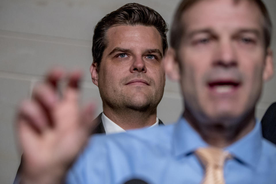 FILE- In this Oct. 8, 2019 photo, Rep. Jim Jordan, R-Ohio, ranking member of the Committee on Oversight Reform, foreground, accompanied by Rep. Matt Gaetz, R-Fla., center, speaks on Capitol Hill in Washington. Gaetz is an unabashed supporter of President Trump, defending him on the impeachment inquiry, the investigation into Russia meddling in U.S. elections and other issues. (AP Photo/Andrew Harnik, File)