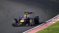 Red Bull Formula One driver Sebastian Vettel of Germany races during the Japanese F1 Grand Prix at the Suzuka circuit October 13, 2013. REUTERS/Issei Kato (JAPAN - Tags: SPORT MOTORSPORT F1)